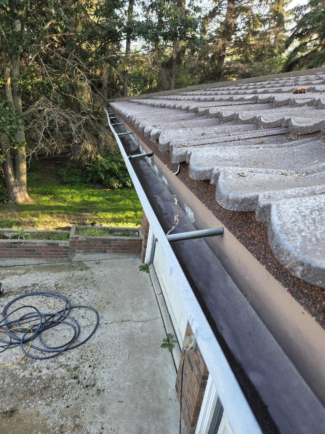 Tile-roof gutter after debris was removed